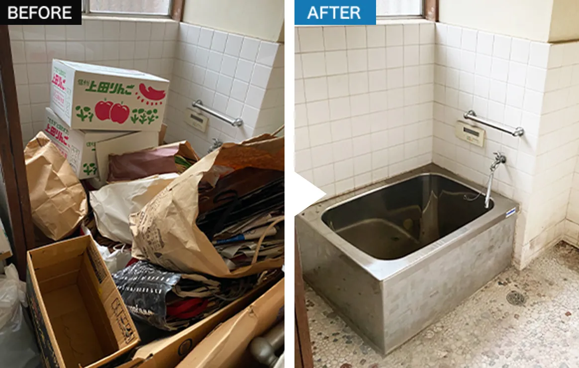 掃除機を使って床を清掃する作業員